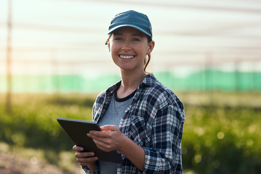 woman with tablet in an greenhouse